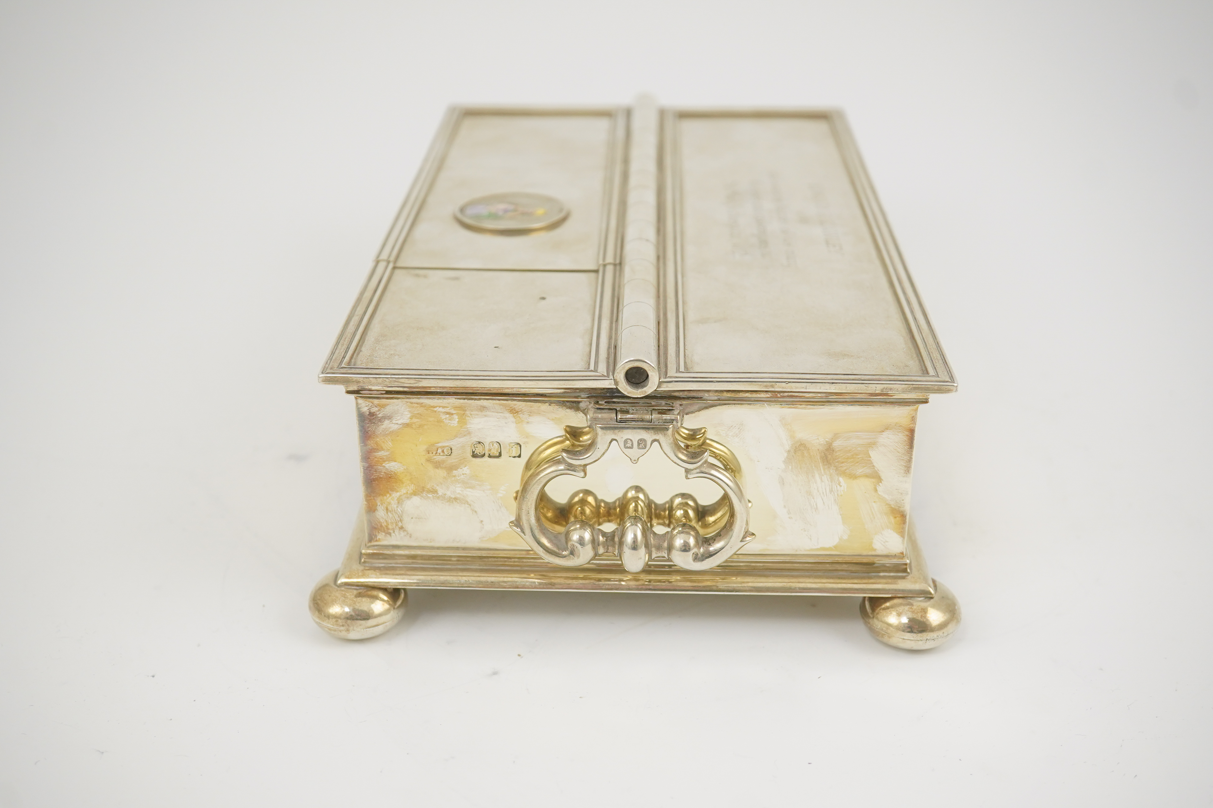 A George V Britannia standard silver and enamel combination ‘treasury inkstand/ cigarette box, by Crichton Brothers